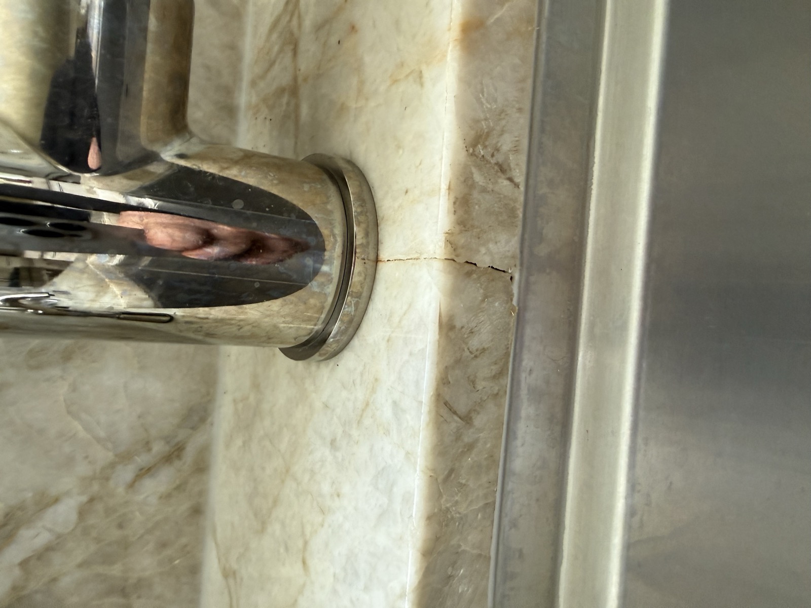 Crack in stone near a faucet fixture